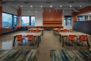 Photo-classroom space featuring orange accents