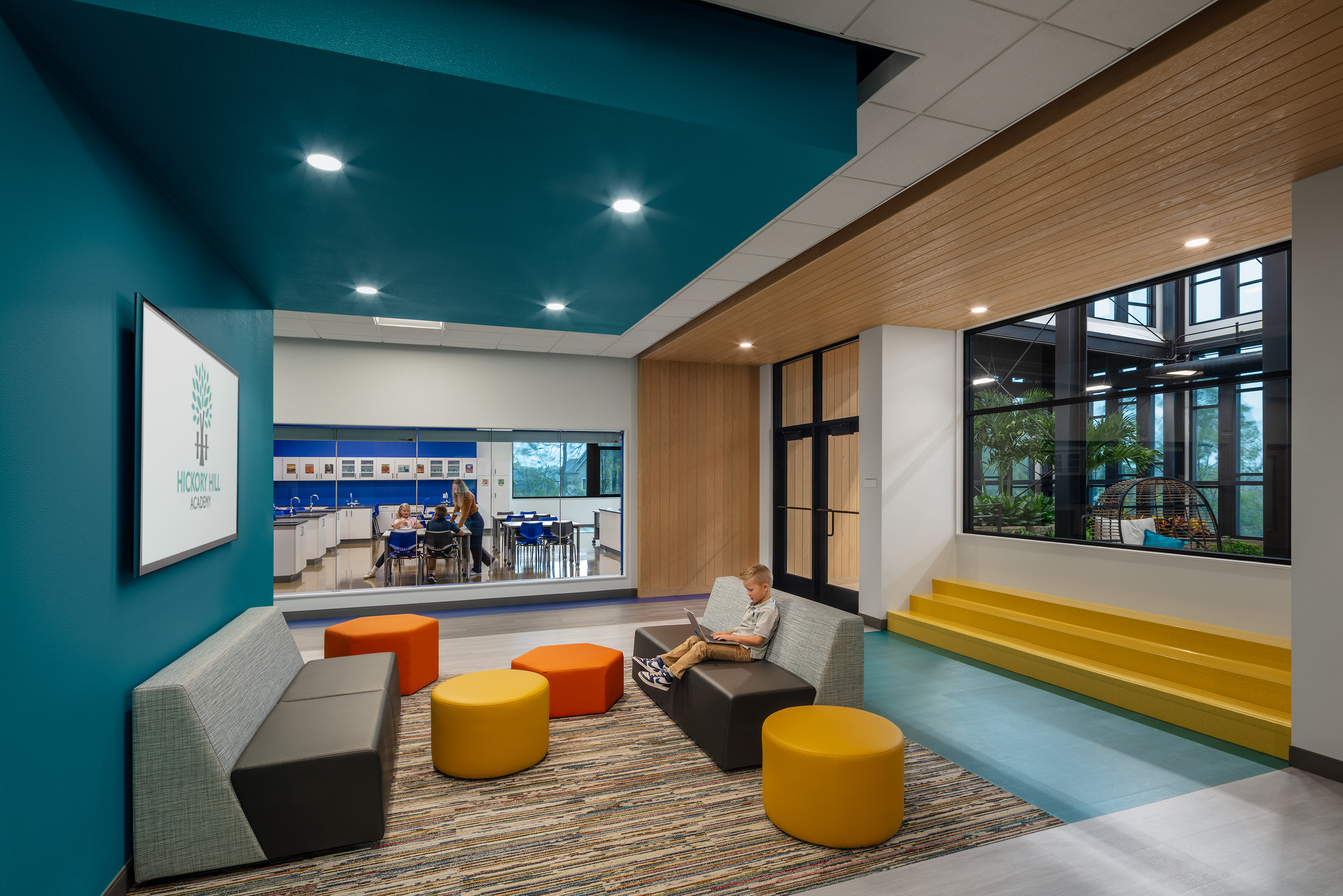 Photo-hallway with seating area and monitor for working and learning