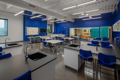 Photo-Lab space with bright blue colored walls and concrete flooring