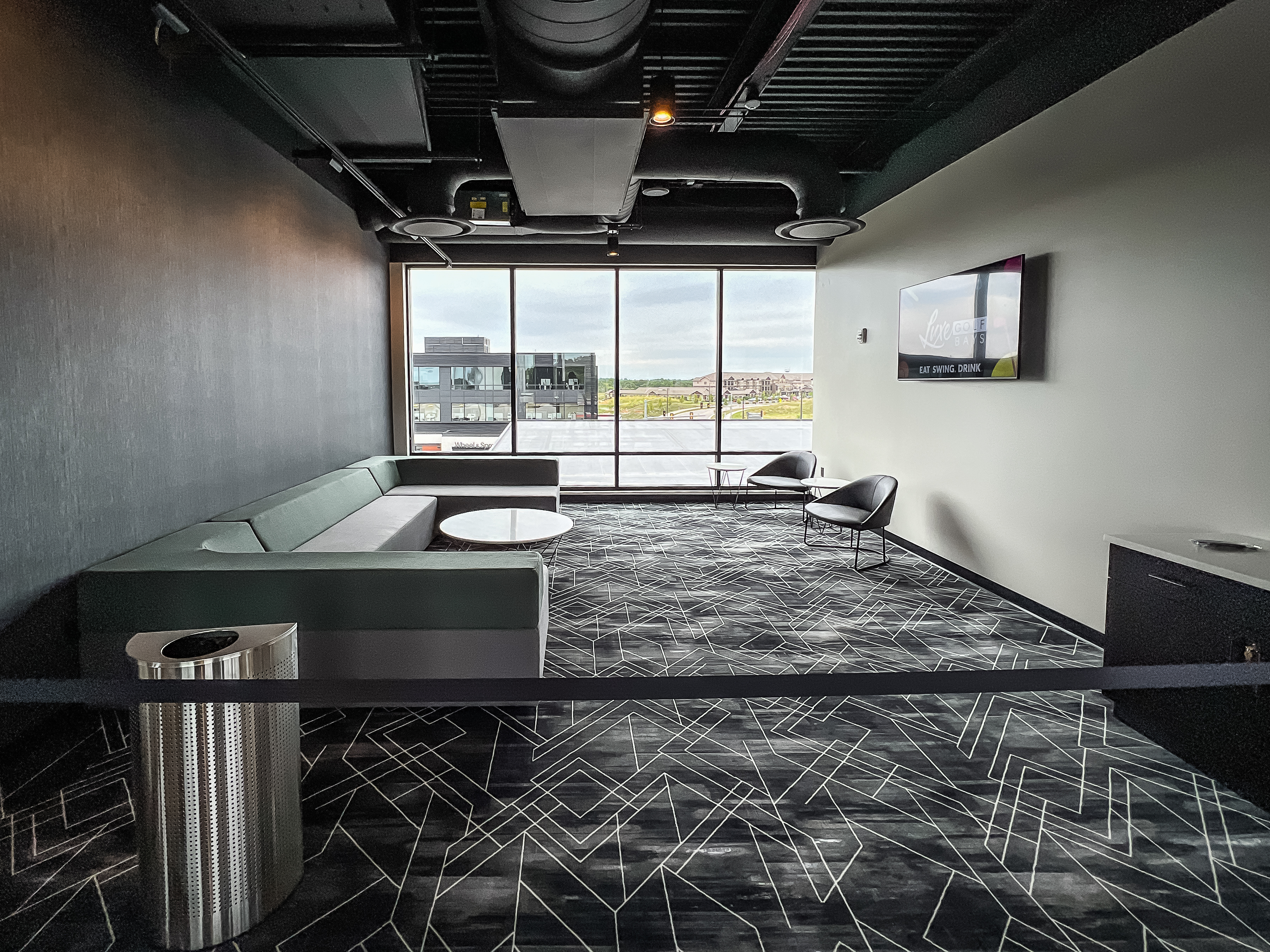 private area lounge area with large windows and lounge seating