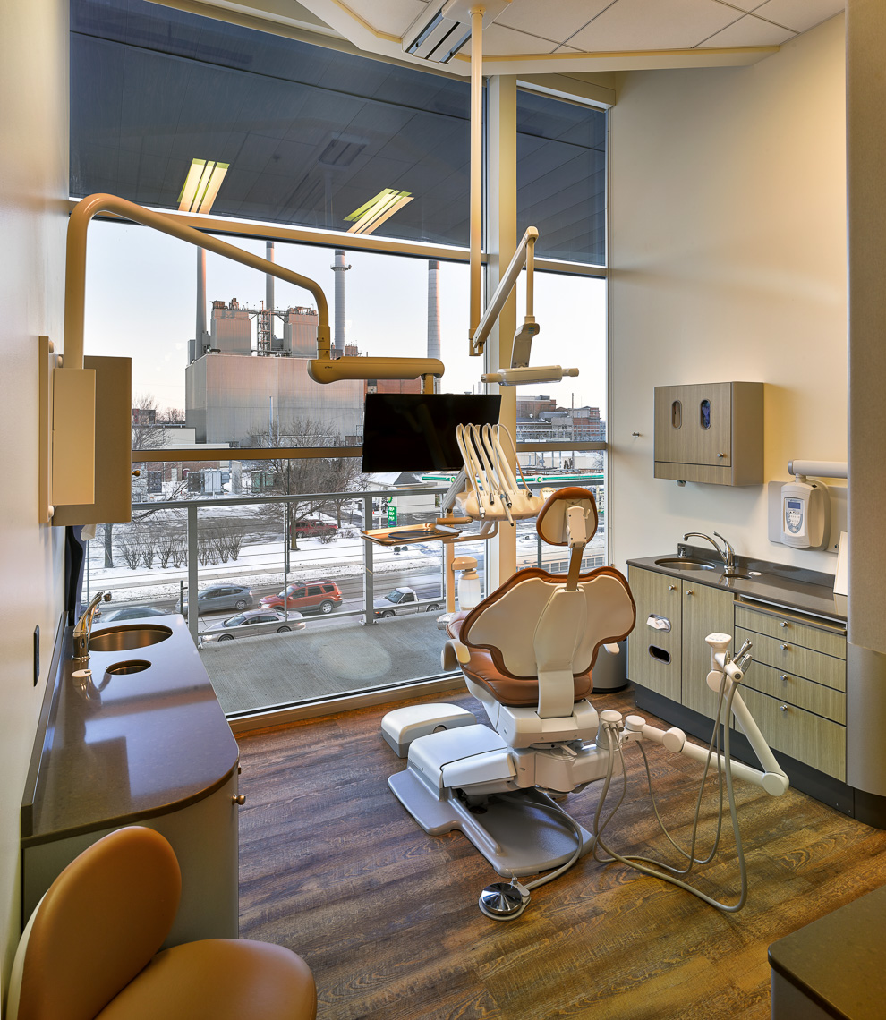 Dental Operatory with floor to ceiling window, dental chair and equipment