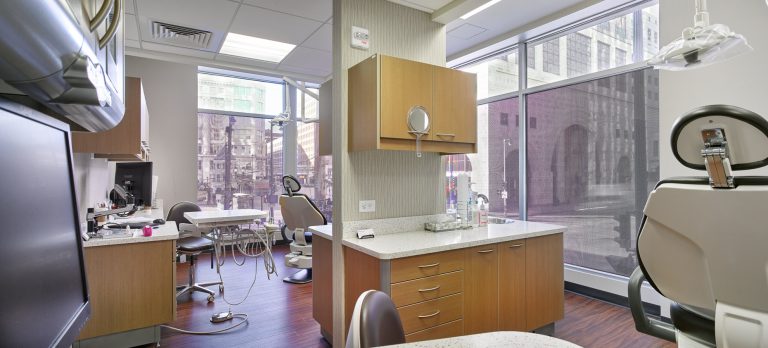 Open Dental operatory space with multiple dental chairs and equipment