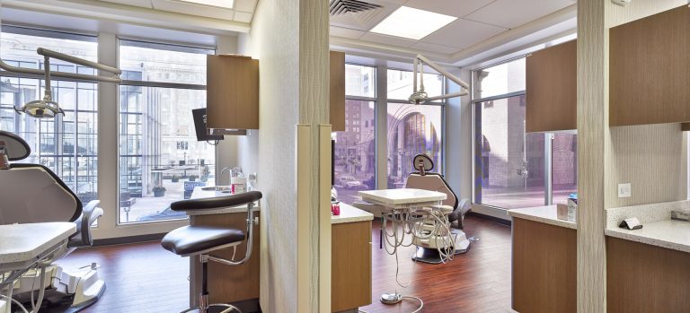 Private Dental operatories spaces with chairs and floor to ceiling window views