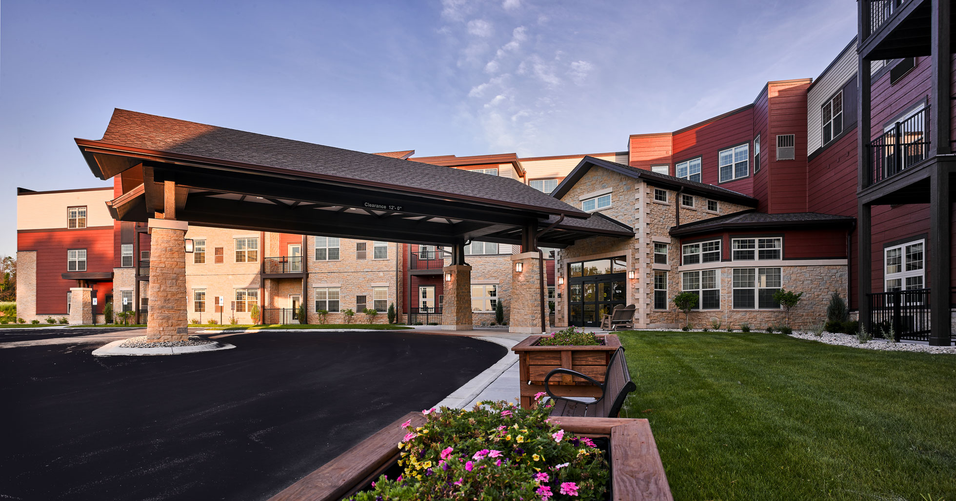 Exterior covered drive up entrance to senior living facility