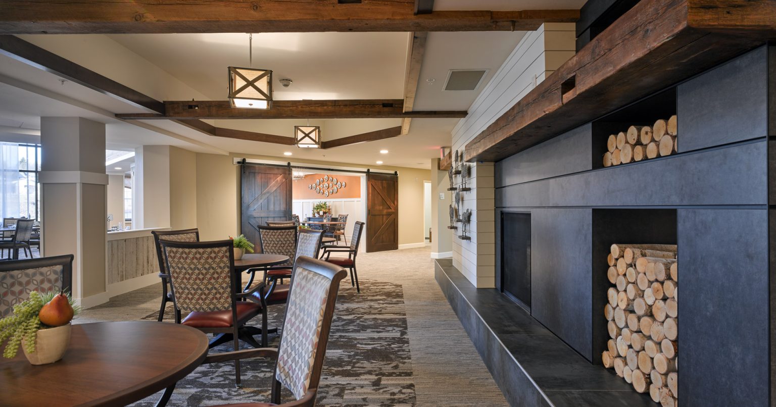 Senior Living facility Lounge area with dim lighting, and horizontal shiplap