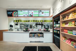 Sushi restaurant order counter with light up signs and cash registers