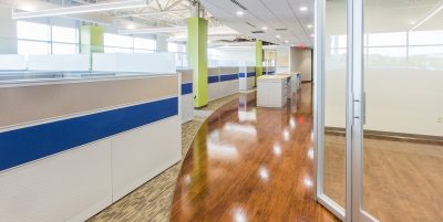 modern, well lit office cubicle area with light gray cubicles