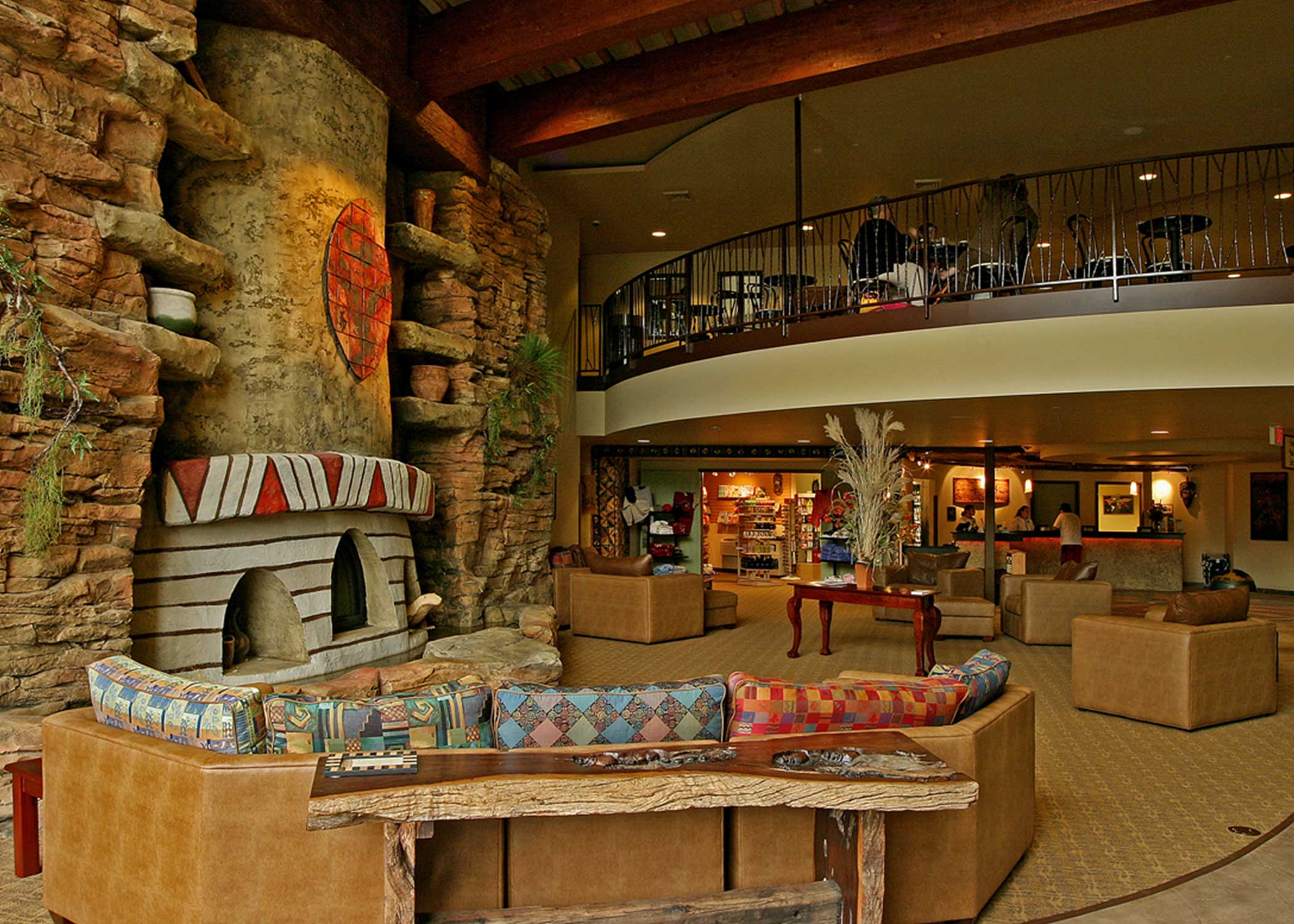 interior of water resort lobby tribal fireplace with open balcony to upper level