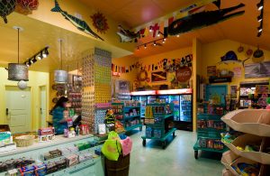 Snack area with yellow colored walls, drink coolers and snacks