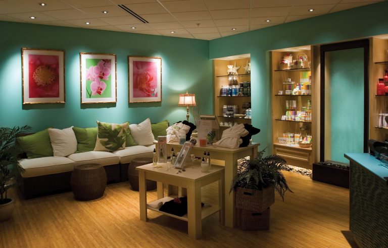 Spa with dim lighting, and teal colored walls