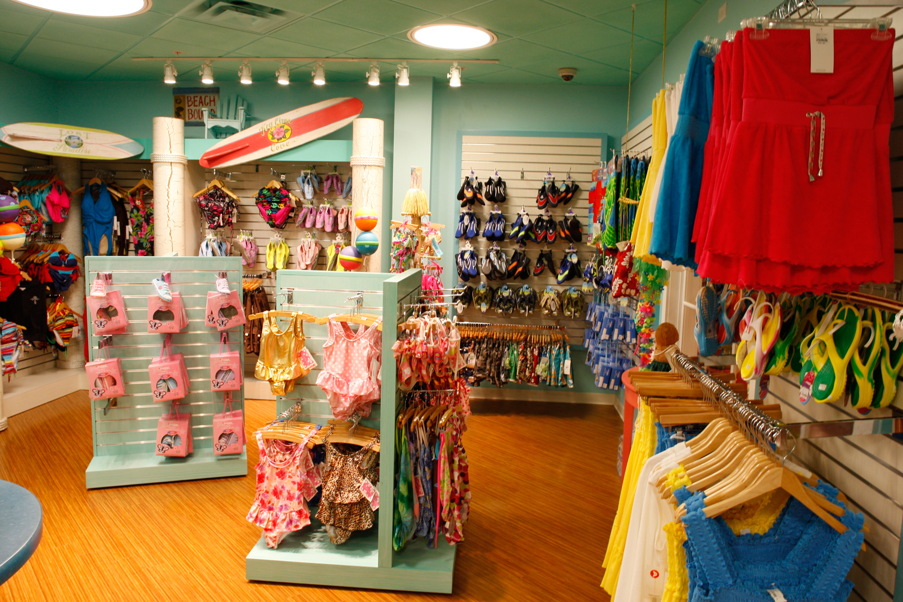 Swim shop with light blue walls and swimsuits