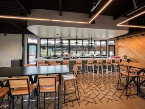 modern bar with wood accents and patterned flooring