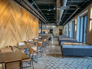 Restaurant and bar seating area with booths and tables