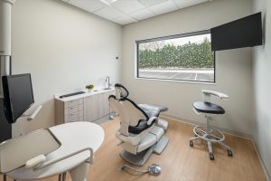 Dental operatory with chair facing window and dental equipment