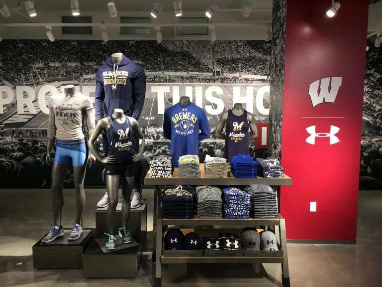 A retail display featuring Milwaukee Brewers sports apparel.