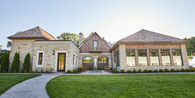 Exterior shot of country club with clean up grass, cream colored bricks