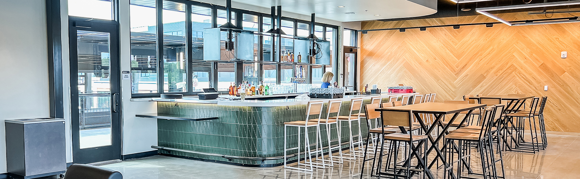 modern bar with wood accents and patterned flooring