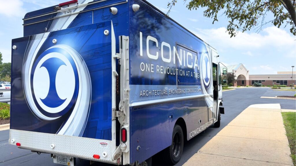 Blue Iconica food truck in parking lot of construction project