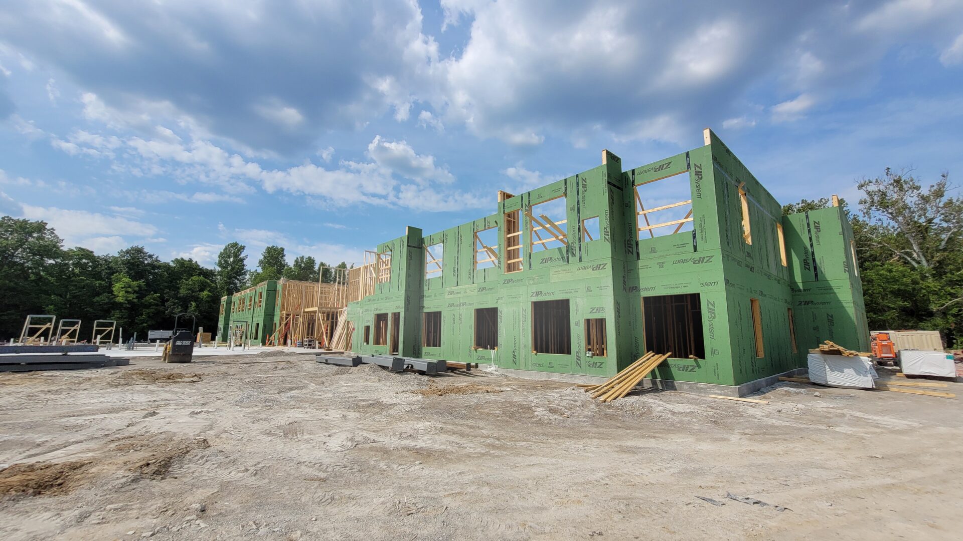 construction job site that has a concrete slab and some framing done