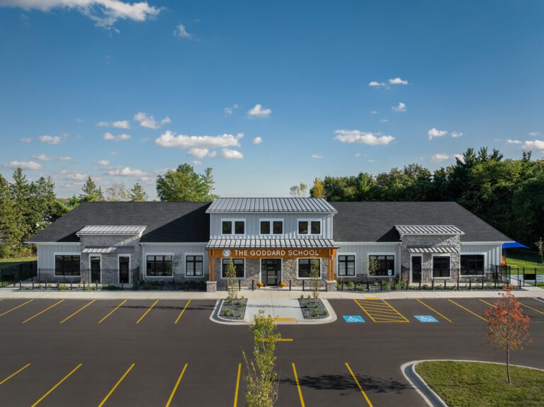 Front elevation of The Goddard School with main entrance and parking.