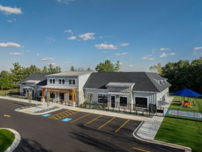 Aerial view of The Goddard School with playground and parking lot.