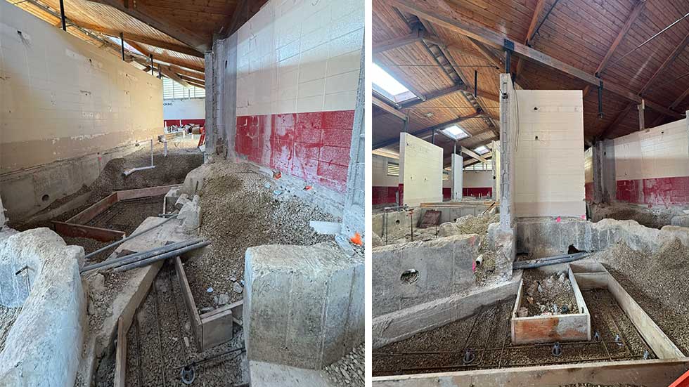 Construction in progress inside the Sheehan Park Aquatic Center bathhouse, with concrete block walls and wood ceiling trusses exposed.