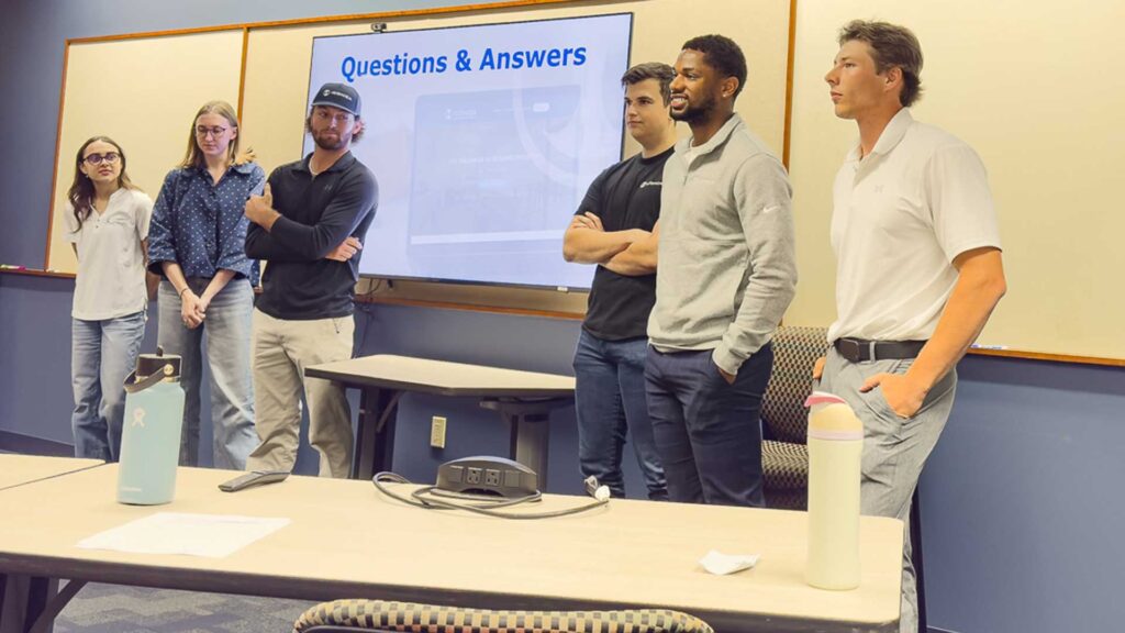 Group of interns during question and answers section of final intern presenations